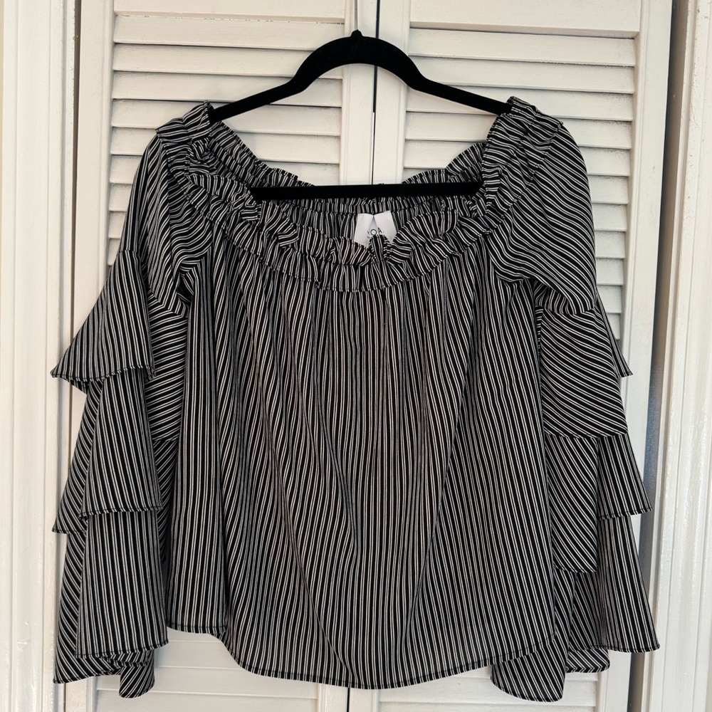 This super cute top can be worn off the shoulders or not.